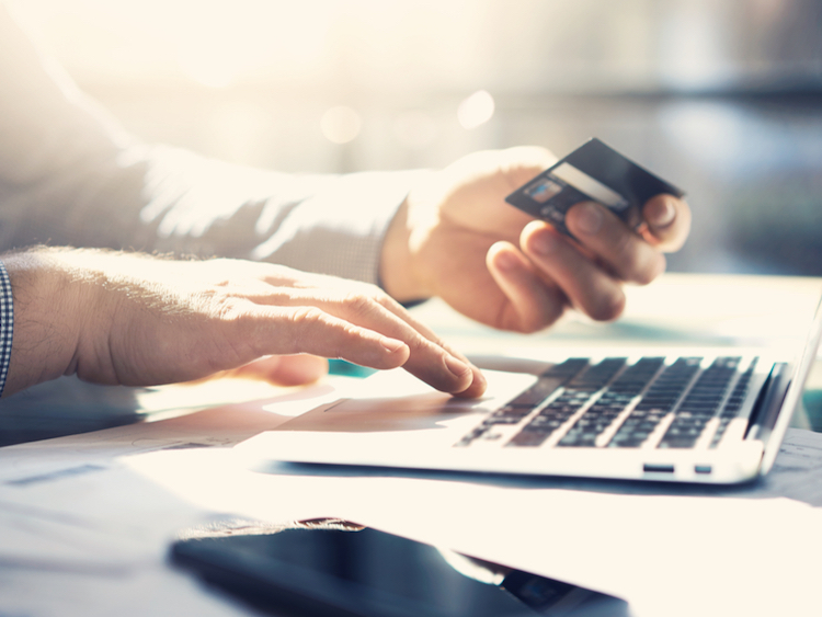 man at laptop with credit card