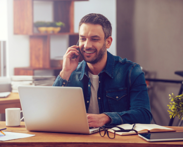 man on the phone with a laptop