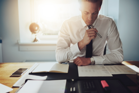 a businessman looking over paperwork