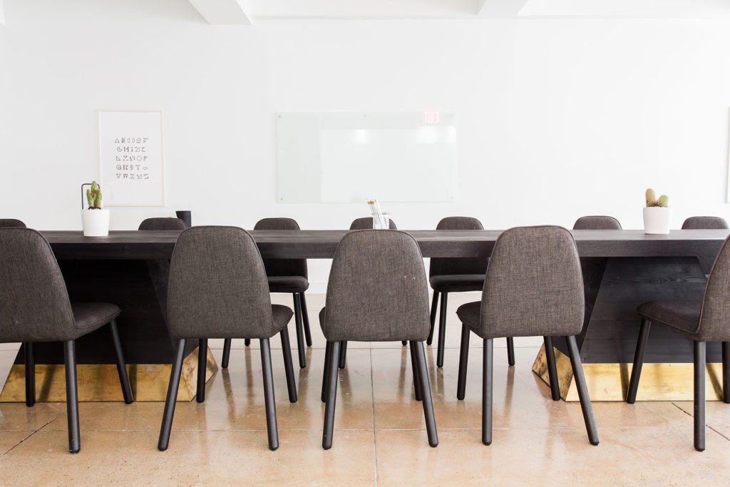 Conference room with table and chairs for claims management business.
