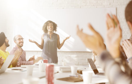 a woman speaking at an informal meeting