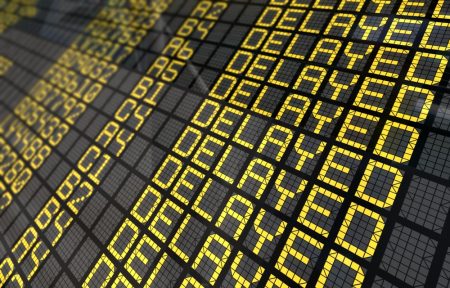 Delayed flights in flight status board.