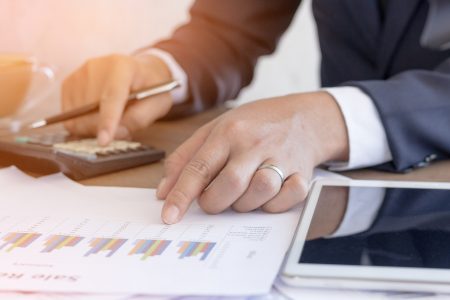 close up of desk with someone using IVA software