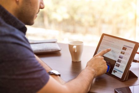 Man searching for a PPI company on his iPad.