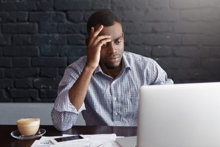 Man in front of a laptop needing PPI help.