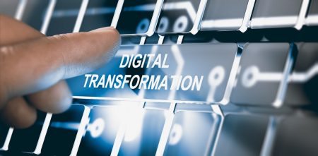 Finger pressing an interface with the text digital transformation. Blog post about what is digital transformation?